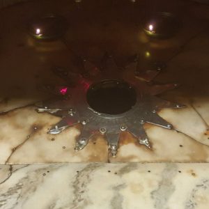 the fourteen-point silver star at the grotto of the church of nativity marking the traditional spot of Jesus' birth